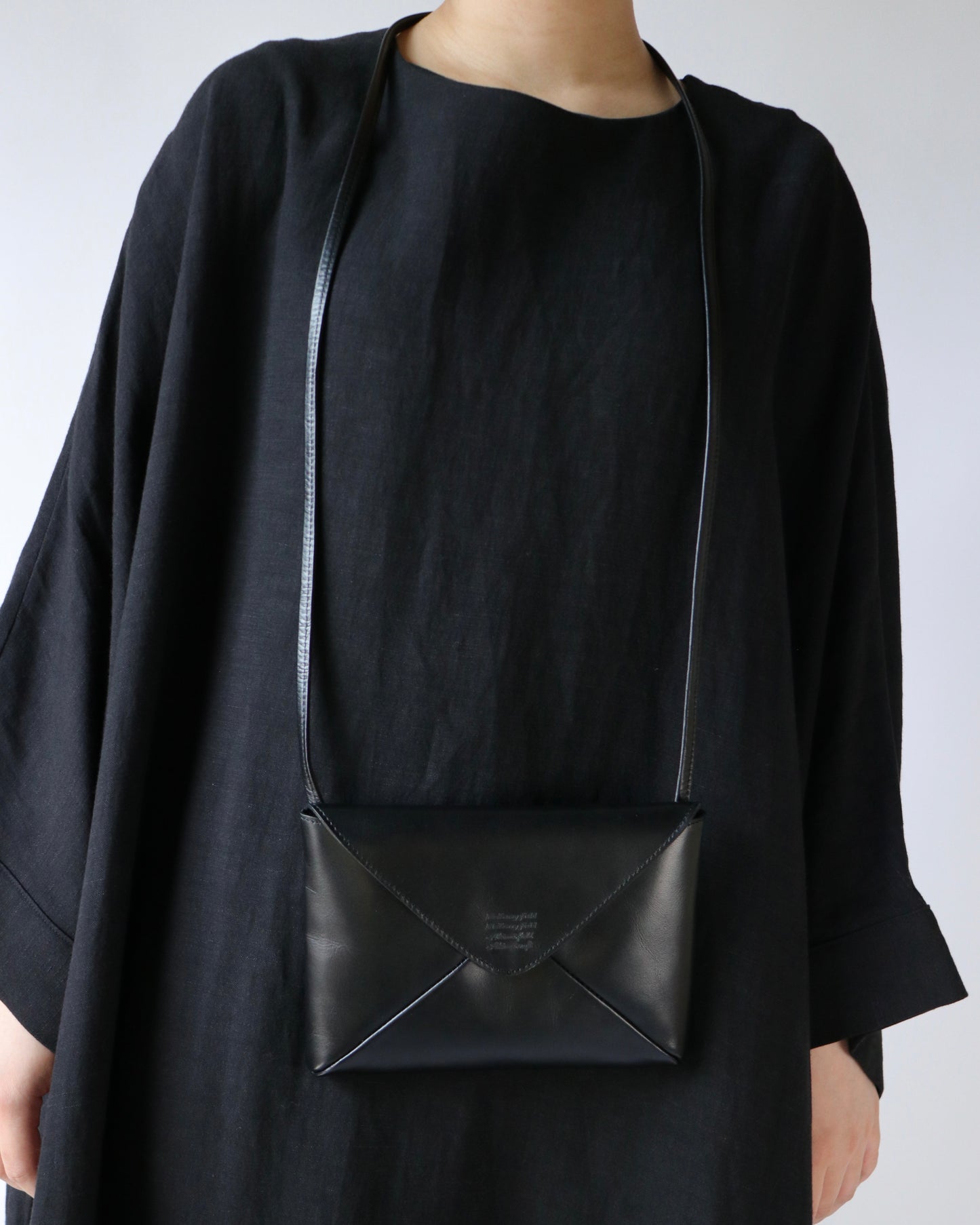 Naturally-tanned leather envelope purse